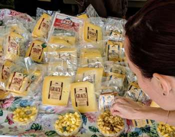 woman samples cheese