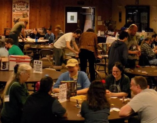 people at a gaming convention playing tabletop games