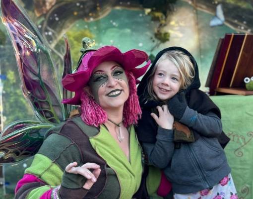 fairy poses with little girl