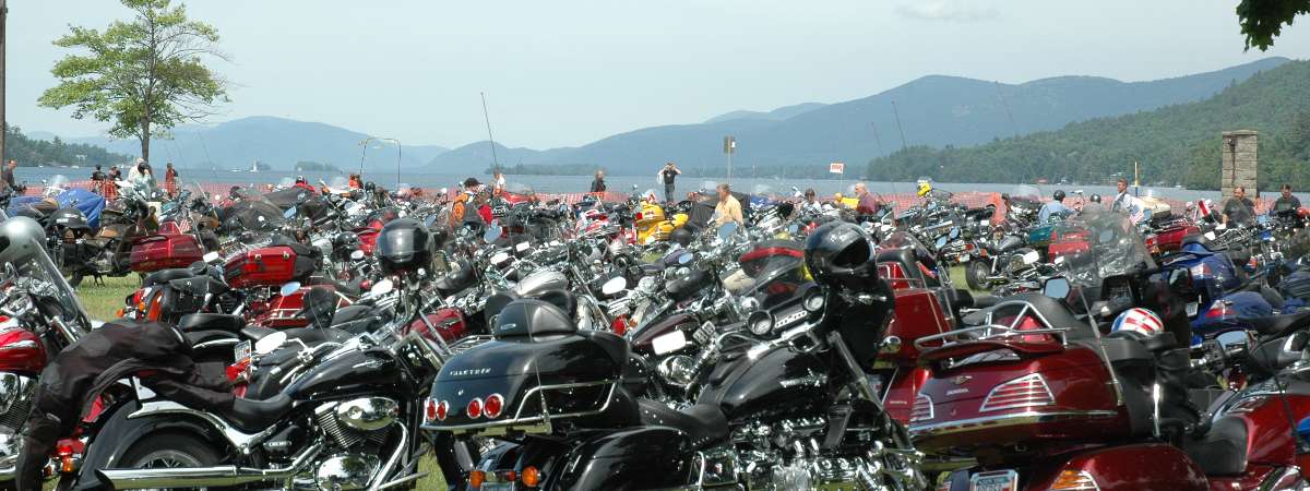 motorcycles parked on grassy field