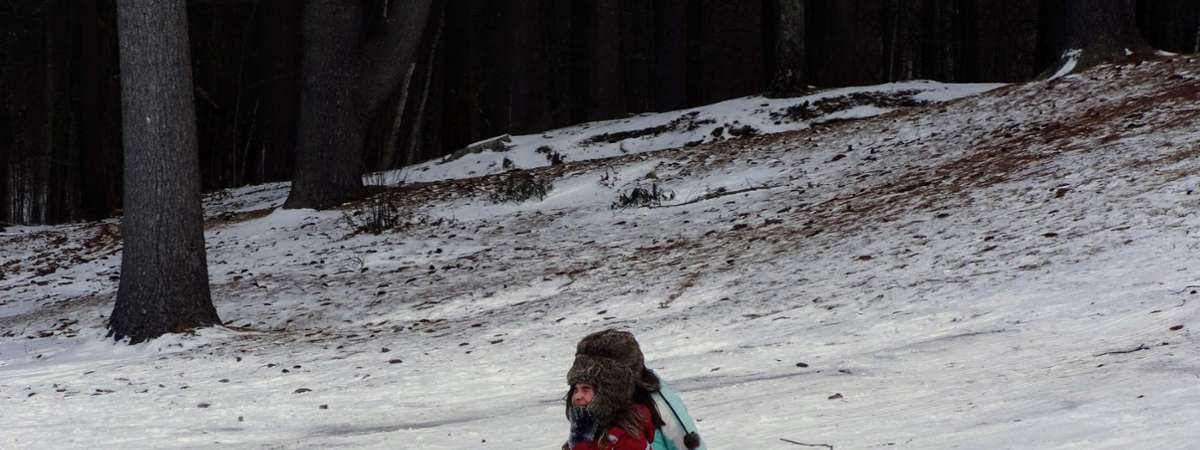kid sledding down a hill
