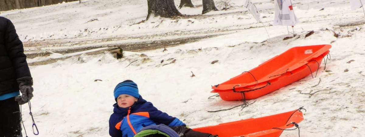 kid about to sled down a hill