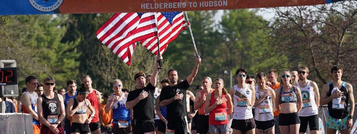 people standing at start line of a race