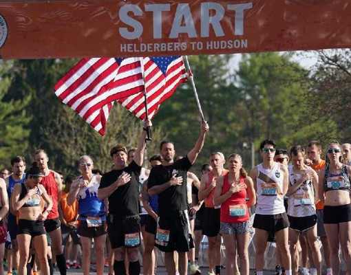 people standing at start line of a race