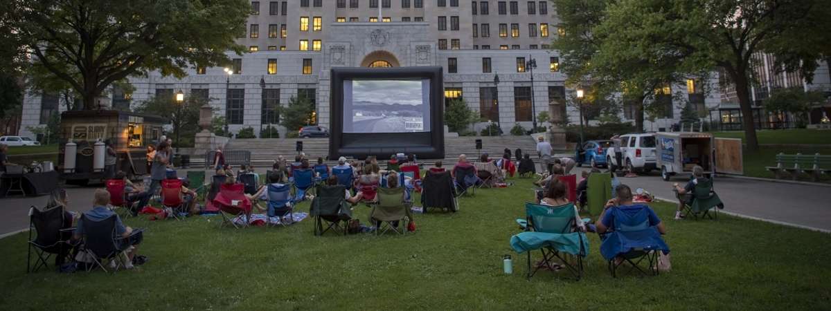 people watching outdoor evening movie