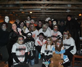 people dressed in a spooky haunted barn