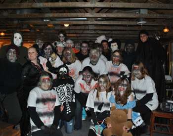 people dressed in a spooky haunted barn