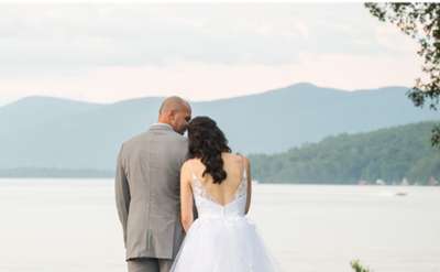 View of bridal couple in front of Lake George