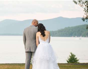 View of bridal couple in front of Lake George