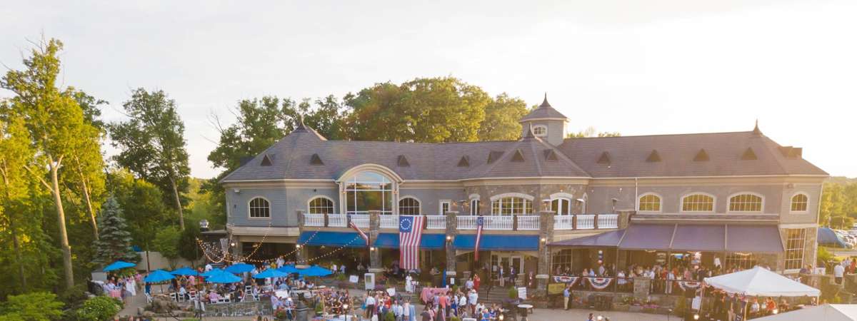 crowd on the patio at prime at saratoga national