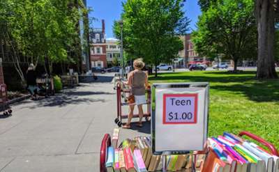 books on carts in the park