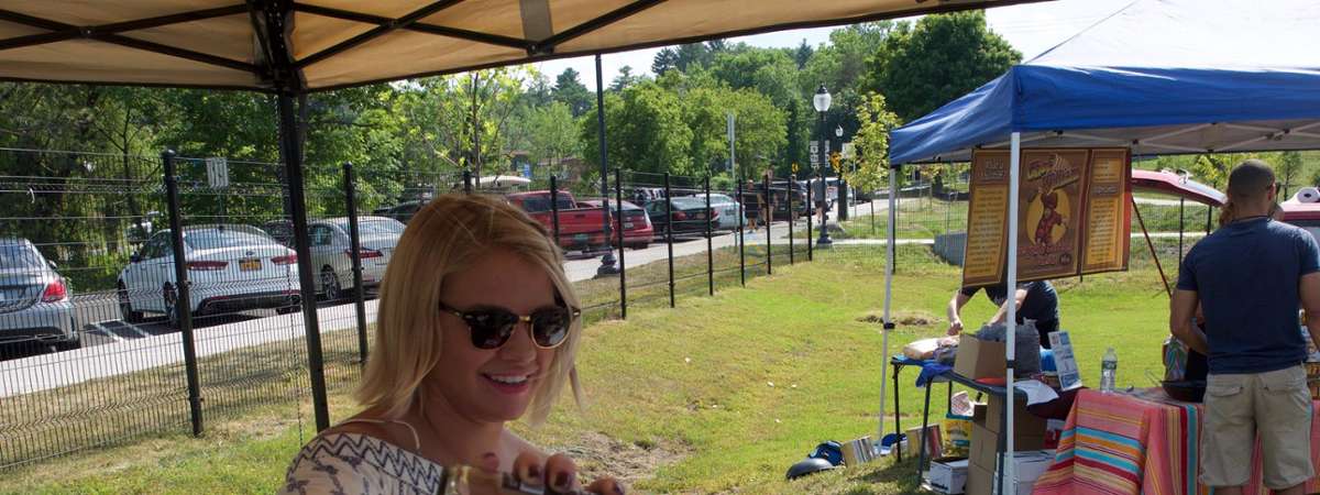 woman pouring a wine sample