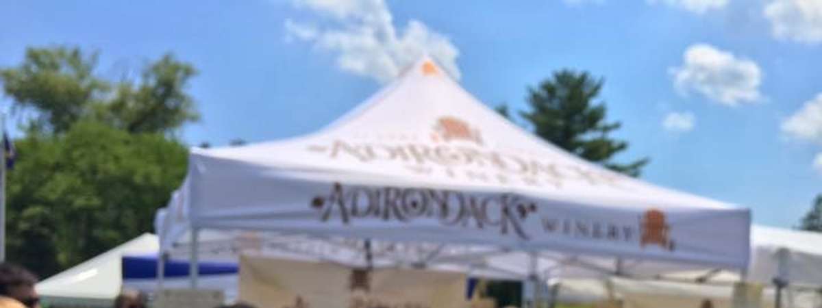 empty wine glass in front of a tent