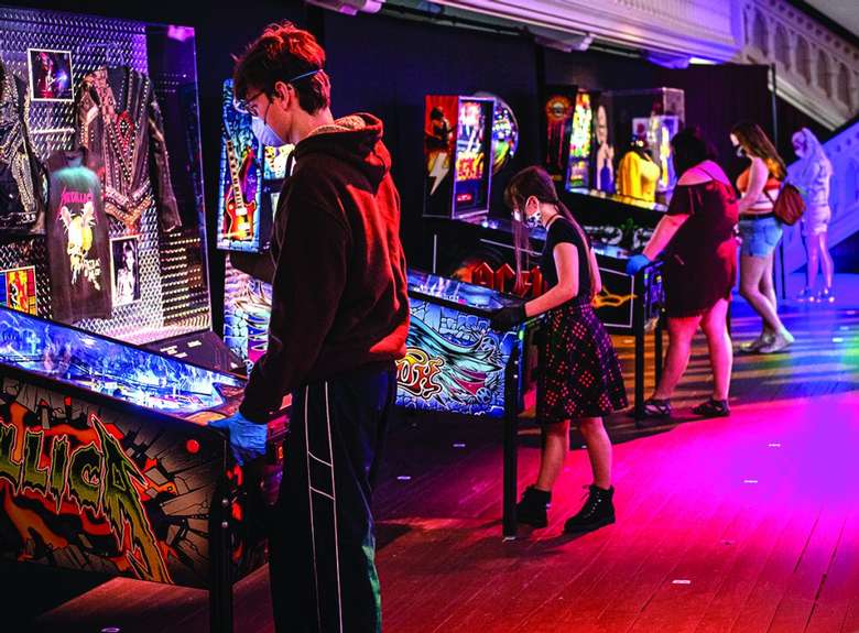 Photo by Jim Gilbert, courtesy of Saratoga Business Journal people playing pinball