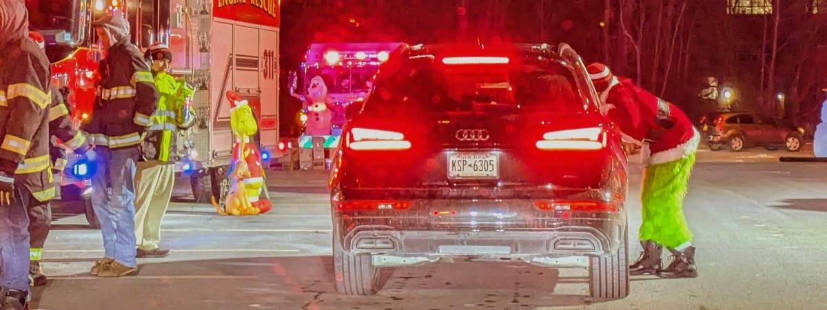 grinch at car at candy cane lane