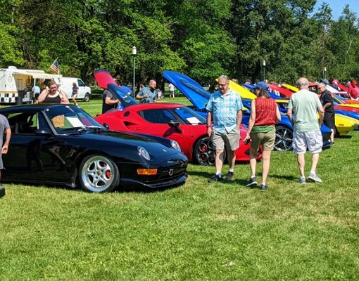 car show on the lawn at auto museum
