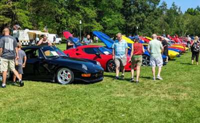 car show on the lawn at auto museum