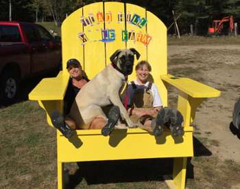 kids with dog in chair