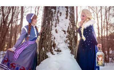 snow sisters by a tree