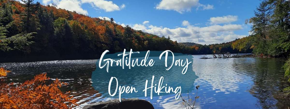 fall lake scene with text gratitude day open hiking