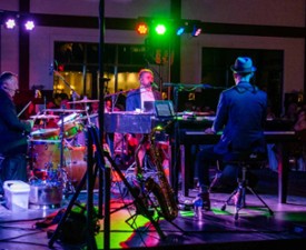 dueling piano performance on a stage