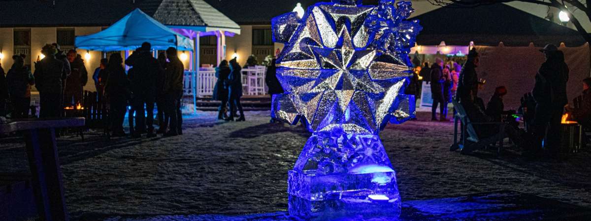 ice sculpture of a snowflake in front of fort william henry