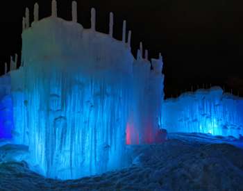 ice castles lit up blue at night