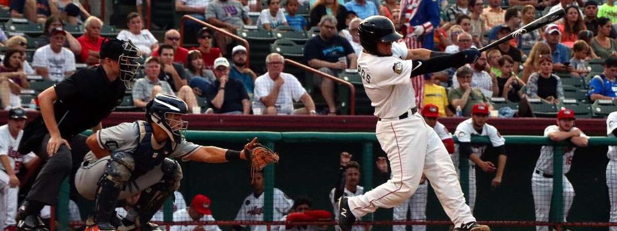 a baseball player swinging bat