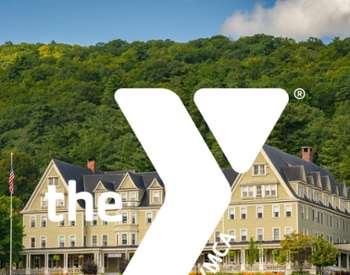 the y logo laid over the silver bay retreat building
