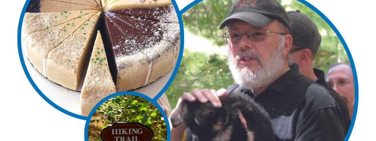cheesecake, hiking trail sign, and man holding dog