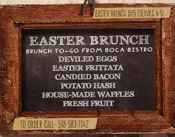 Chalkboard in picture frame showing Easter Brunch box offerings from Boca Bistro