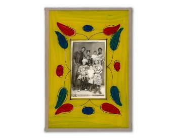 yellow and flower frame around a black and white family image