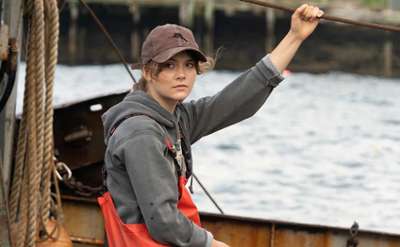 woman in hat on fishing boat