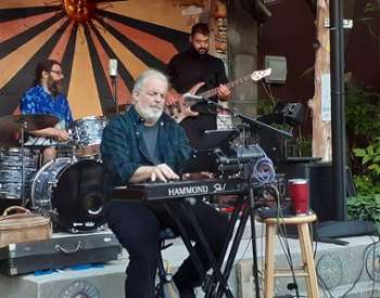 band performs, man in front with keyboard