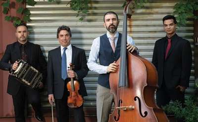 quartet poses with instruments