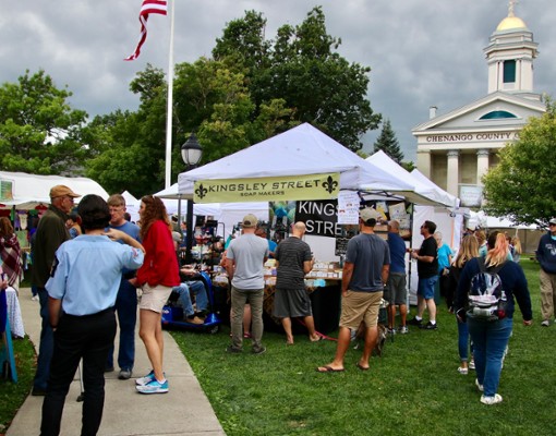 people by vendor tents