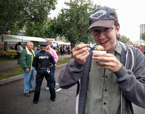 man smiling and eating