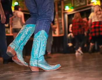 Line dancing, istock blur cowboy boots