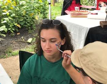 girl getting her face painted