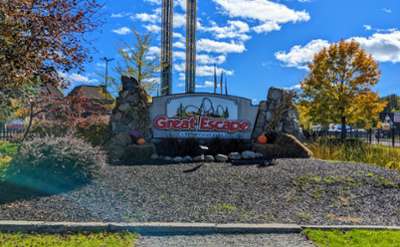 great escape sign with pumpkins