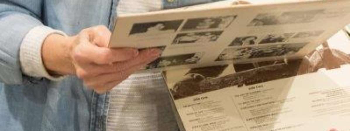 woman holding up vinyls