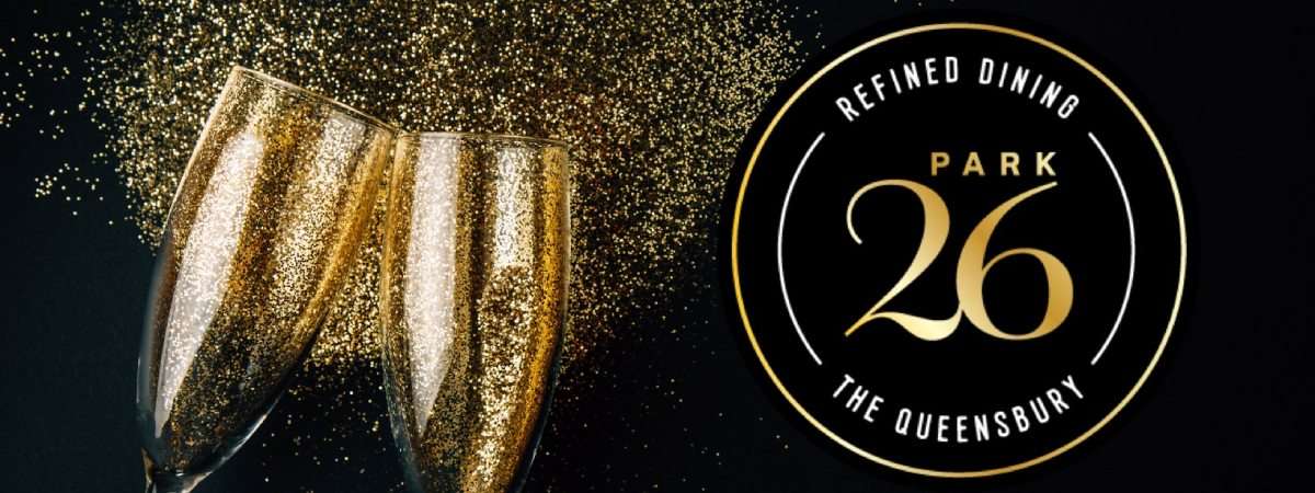chapmagne cheersing with gold glitter, logo says park 26 refined dining the queensbury