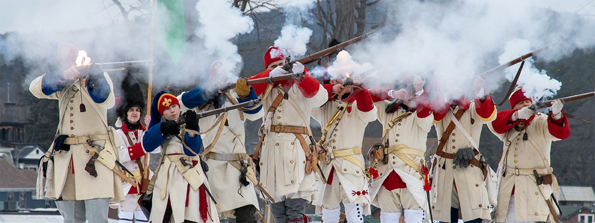 solider reenactors firing weapon