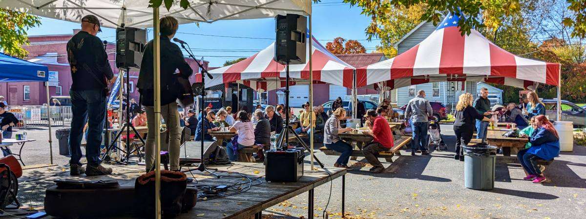live music while people eat at picnic tables at shirt factory