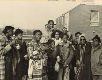Local activist Nell Stokes surrounded by young YWCA members
