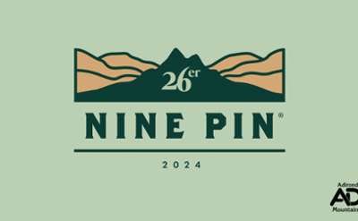 light green background, mountain graphic, text reads Nine Pin 26er 2024