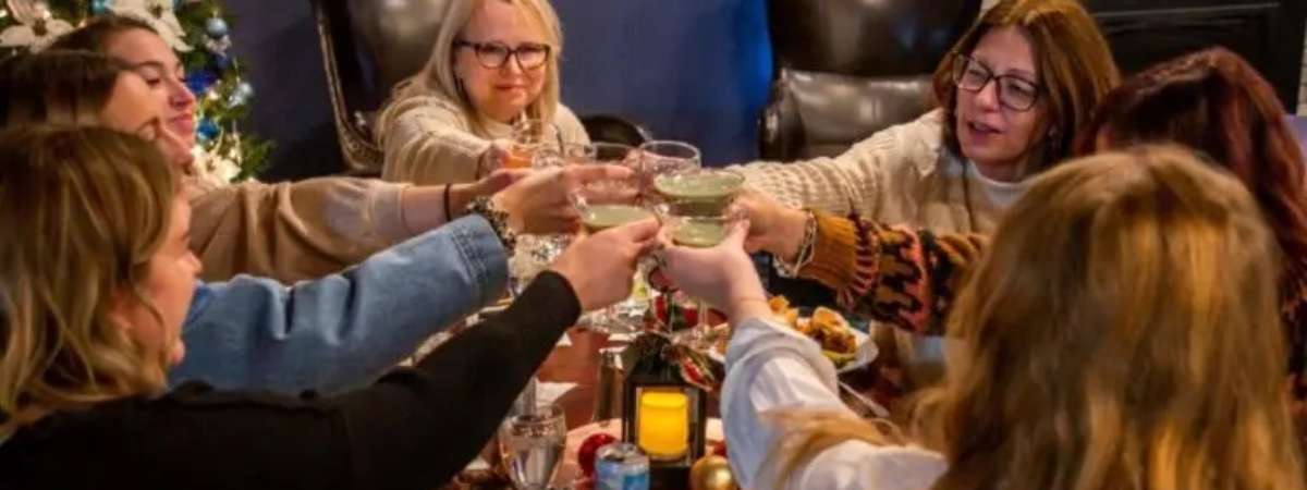group of girls clinking glasses
