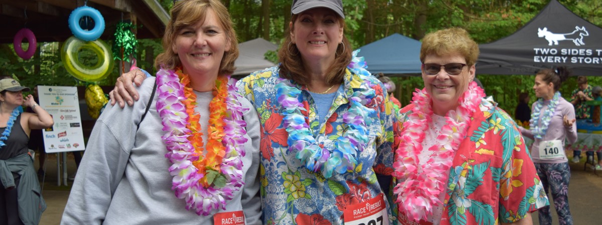 three people pose at alhoa 5k