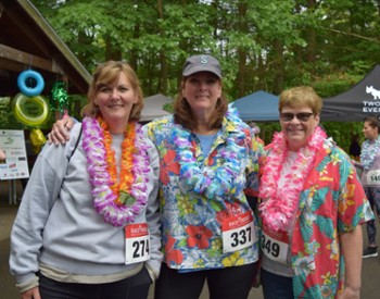 three people pose at alhoa 5k