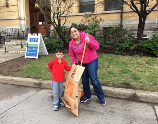 woman and son picking up trash